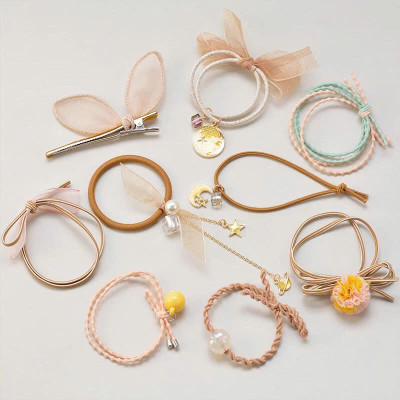 Sét 9 dây buộc tóc và kẹp xinh xắn, có kèm túi lưới phong cách Hàn Quốc, giao màu ngẫu nhiên