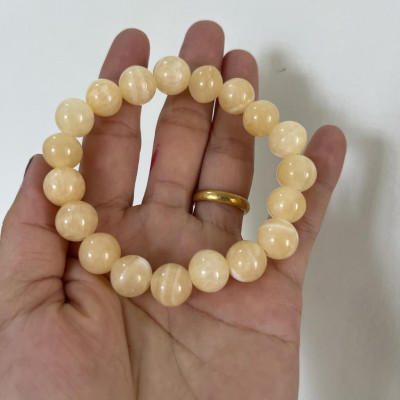 Vòng tay chuỗi hạt ngọc thật màu vàng cam cho người mệnh Thổ và hỏa đường kính hột 10 li (1cm)