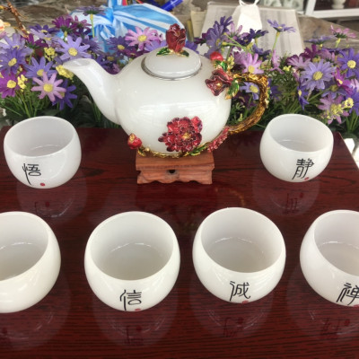 Bộ ấm trà chạm bông hoa mẫu đơn đá bạch ngọc