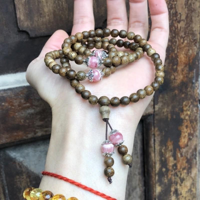 Vòng Tay Trầm Hương phối Đá Đào Hoa cùng charm bạc thái - bình an, may mắn, tài lộc