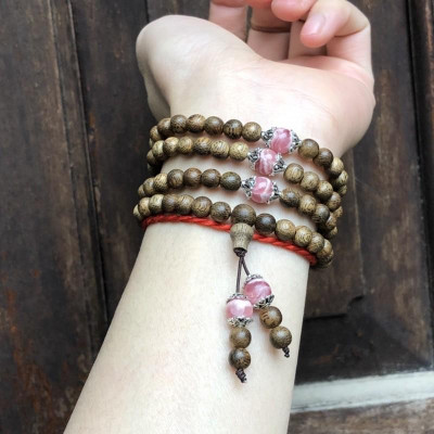 Vòng Tay Trầm Hương phối Đá Đào Hoa cùng charm bạc thái - bình an, may mắn, tài lộc