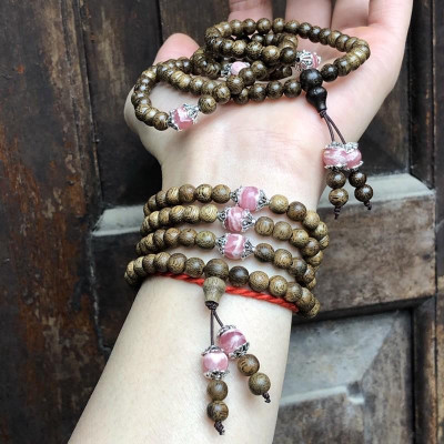 Vòng Tay Trầm Hương phối Đá Đào Hoa cùng charm bạc thái - bình an, may mắn, tài lộc